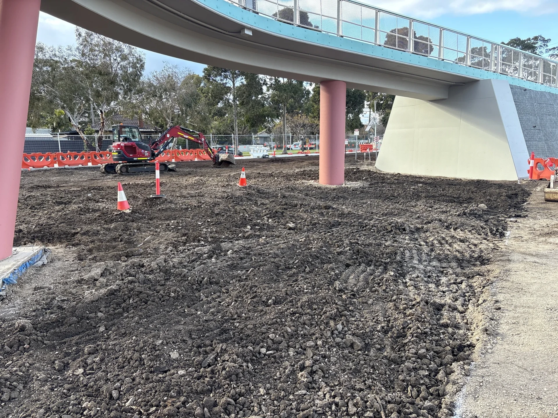 Earthworks progressing within a constrained rail-adjacent workfront at Newport.